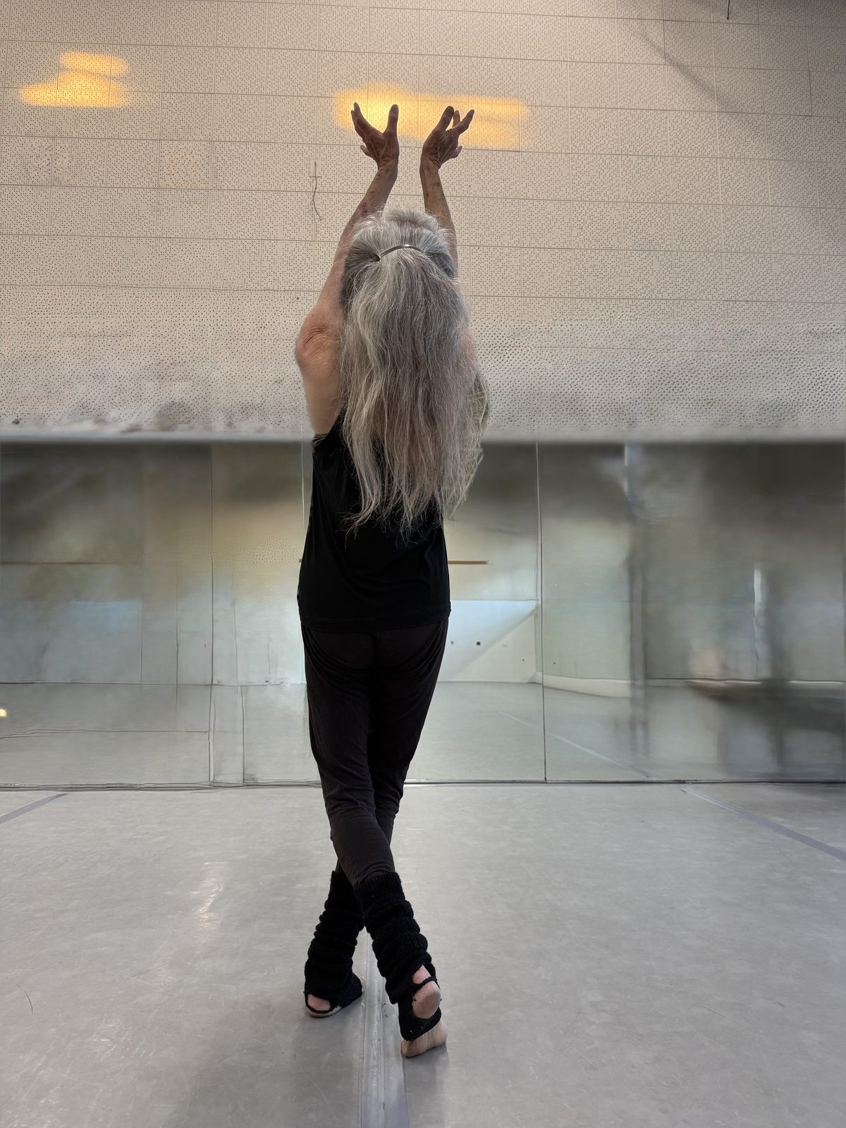 Laura reaching up